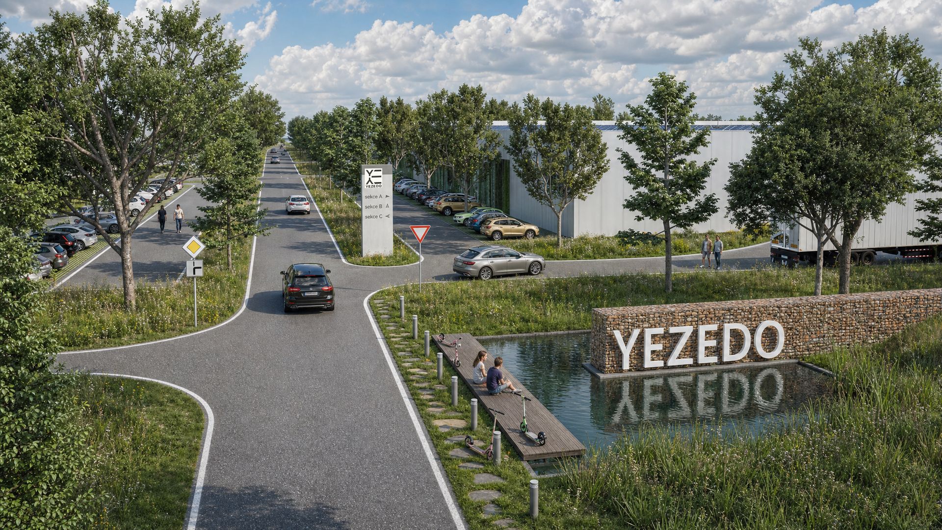 Vjezd do areálu Yezedo Kostice s vodní plochou a nápisem YEZEDO